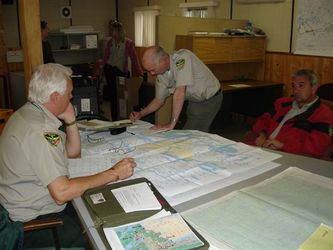 Photo from MNR - Crews planning fire fighting efforts.