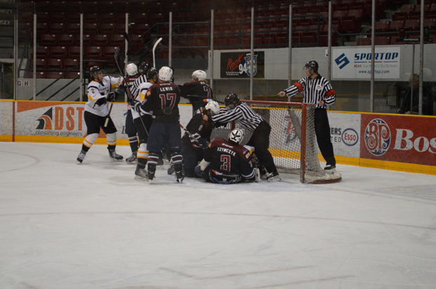 Scrum in front of the Ice Dogs Net