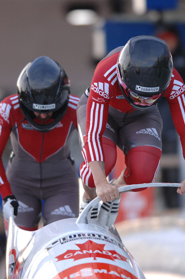 Canadian Bobsledders off to a fast start. Olympic Speed - Photo Credit Charlie Booker