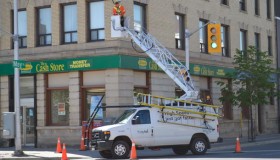 tbaytel crew working on Eye in the Sky camera at May and Victoria corner