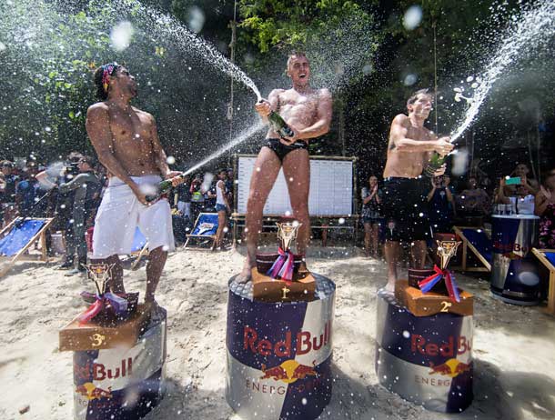 Artem Silchenko (C) of Russia celebrates on the podium on Hong Island with 2nd placed Steven LoBue (R) of the USA and 3rd placed Orlando Duque (L) of Colombia during the last competition day of the eighth and final stop of the Red Bull Cliff Diving World Series, Krabi, Thailand on October 26th 2013.