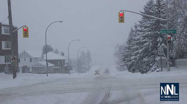 Red River Road and High Street, snow covering the road surface is causing slippery roads.