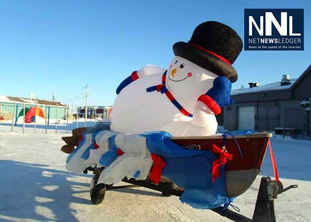 Attawapiskat Christmas Parade. Frosty the Snowman reclines in the perfect conditions for a snowman, Photo by Rosiewoman Cree.