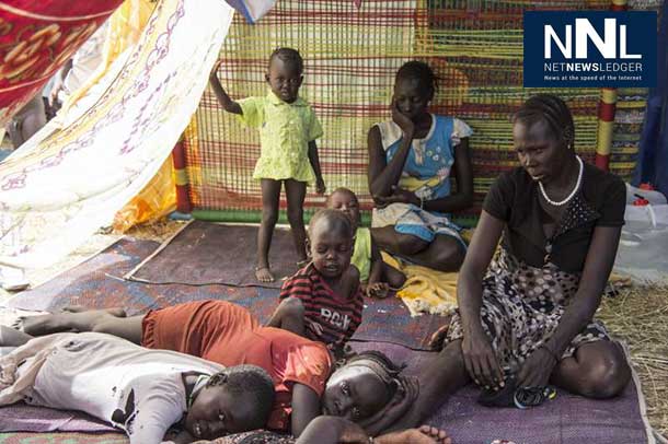 A family of South Sudanese civilians shelter at a UN base in Juba. UNHCR has been taking on increased responsibilities for the 57,000 civilians taking refuge in 10 UN compounds throughout the country. Photo: UNHCR/K. McKinsey