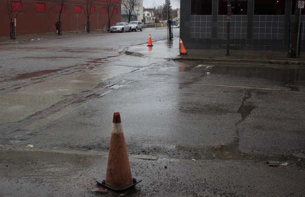 Orange Cones cover where rusted and dangerous street lights once stood.