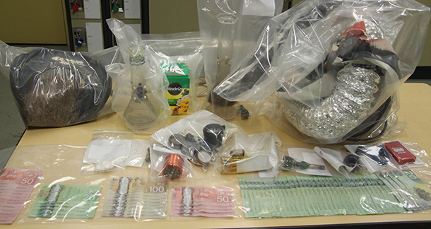 RCMP image of the drugs and money seized in a raid in Fort McMurray