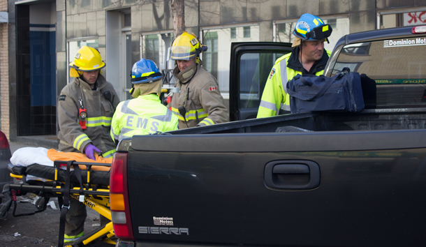 Motor Vehicle EMS Prepares to remove driver from GMC Truck - Accident at Victoria and May Street. Image © NetNewsLedger