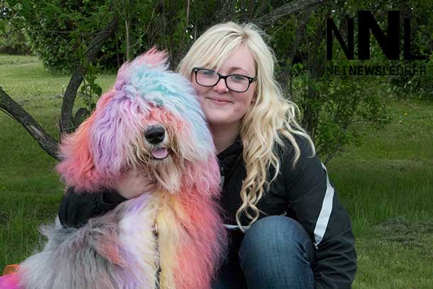 Shannon Dobson and Norman her colourful dog had fun today at Marina Park