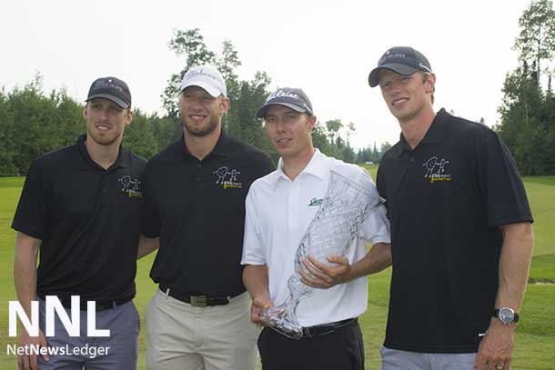Champion Wes Horman with the Staal Brothers and his trophy