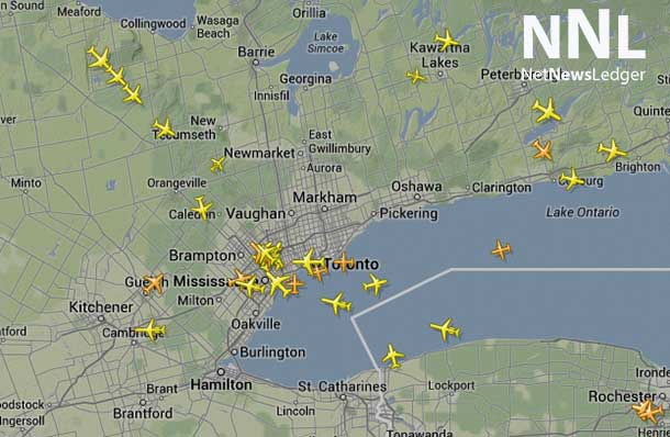 Airplanes are in a holding pattern around Toronto International Airport - July 27 2014 21:34 - Flight Tracker.
