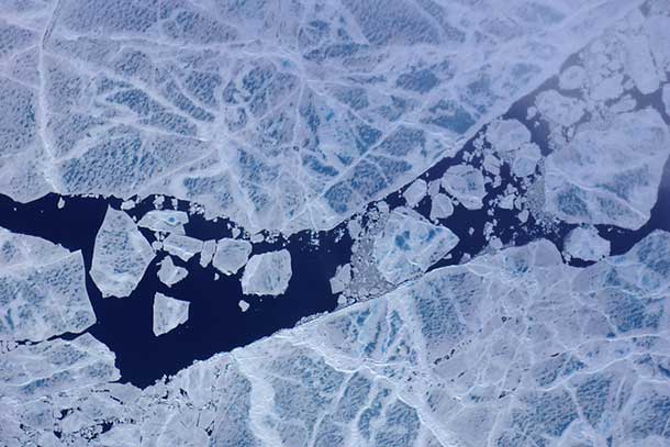 On a July 17 flight to the North Pole and back, the ER-2 aircraft carrying the MABEL instrument flew over fractured sea ice, dotted with melt ponds and marked by ridges formed by the dynamic ice. Image NASA