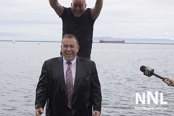 Smiling with enthusiasm as Minister Gravelle accepts the Ice Bucket Challenge for ALS