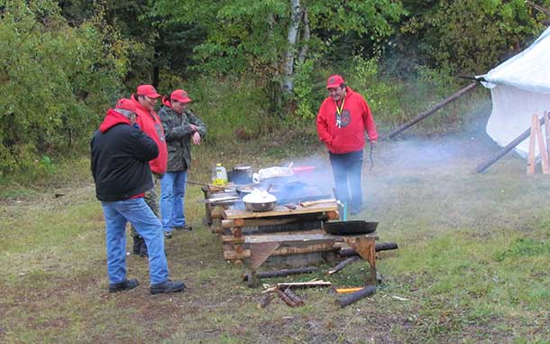 Canadian Rangers preparing food for a special breakfast for Sophie, the Countess of Wessex, during her visit to Kitchenuhmaykoosib.