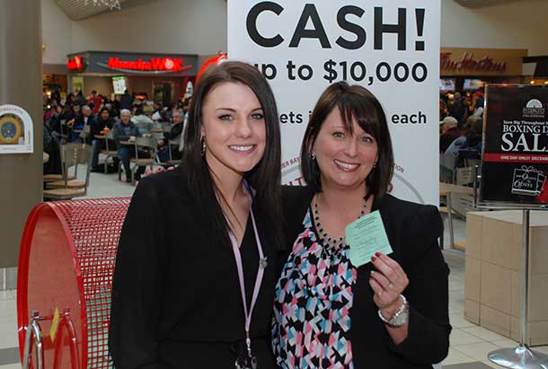 Sierra Beaton, winner of $10,000 in the 15th annual Intercity Shopping Centre Ultimate 50/50 Cash Draw, with Stacey Ball of Intercity Mall