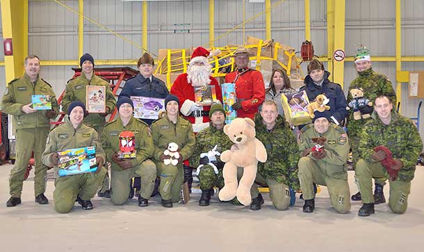 Santa along with his special helpers from the RCAF and RCMP pose for a quick snapshot
