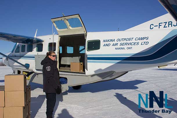 Unloading a plane full of bottled water in Ogoki Post / Marten Falls First Nation