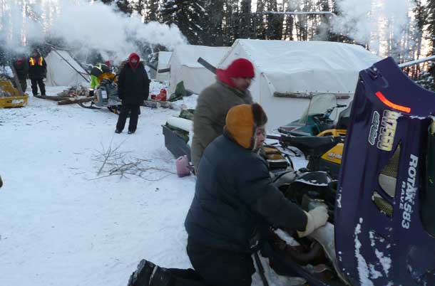 Rangers worked to keep their snowmobiles working in bitterly cold temperatures