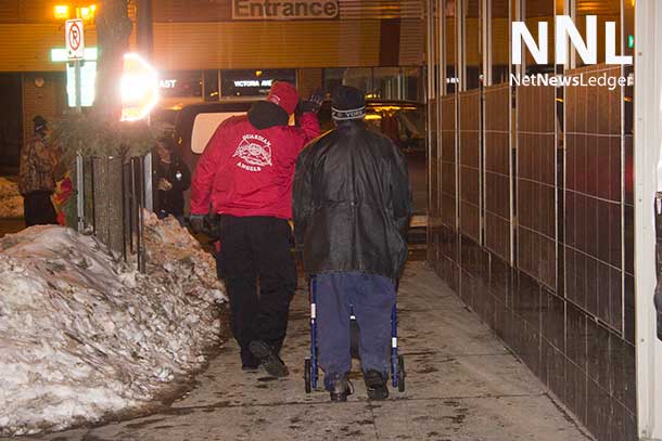 The Guardian Angels helping a man get some help, in this case from the SOS Team in downtown Thunder Bay