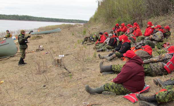 Canadian army instructor gives a safety lecture to Canadian Rangers on Cheepay Island