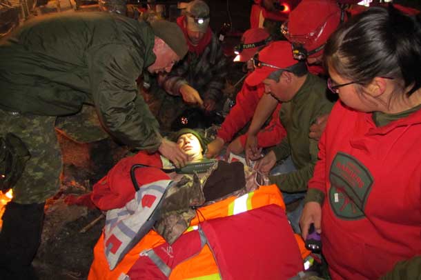 Rangers use their training to warm a victim recovered from cold waters during night exercise