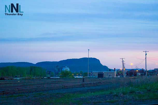 Anemki Wajiw or Mount Mckay in the background, and CP Rail in the foreground.