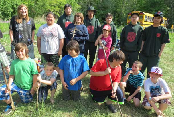 Standing at the back of some of the southern Aboriginal youngsters at a Vision Quest camp are, from left, Junior Canadian Rangers Saul Chookomolin, James Wesley, Louis Wesley, Chris Rose, and Raine Iahtail. - Photo by Sgt. Peter Moon - Canadian Rangers