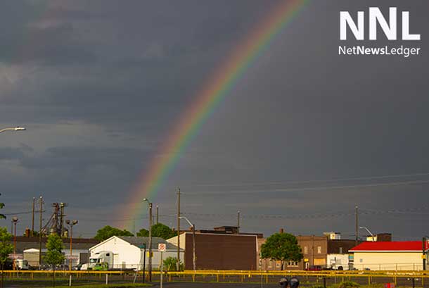 First storm generated loud thunder, and knocked down some trees and branches... afterward a rainbow in the South Side