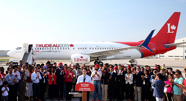 Justin Trudeau stands in front of the new Liberal campaign plane