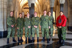 From left to right: Warrant Officer Mike Hebert, Sergeant Joanne Henneberry, Master Corporal Samantha Dean, Master Bombardier Alexander James Zaporzan, Captain Alexander Buck, Master Corporal Genevieve Gobeil, and Master Corporal Pam Chookomoolin. A group picture taken inside the Parliament during a private tour.