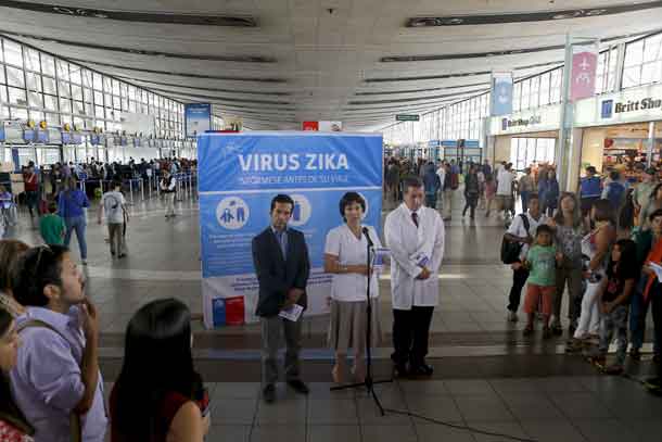 Chile's Health Minister Carmen Castillo (C) talks to the media during an information campaign on Zika virus by the Chilean Health Ministry at the departures area of Santiago's international airport, Chile January 28, 2016. The banner reads: "Zika virus, know before your trip". REUTERS/Ivan Alvarado