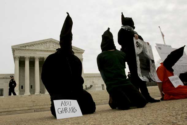 District of Columbia Anti-War Network activists take part in a demonstration to oppose "American violations of international human rights" at the Abu Ghraib prison in Iraq by U.S. military personnel in front of the U.S. Supreme Court in this February 9, 2005 file photo. REUTERS/Larry Downing/Files