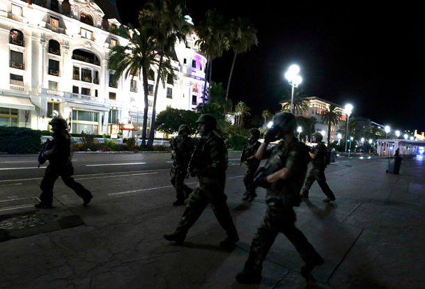 French soldiers advance on the street after at least 30 people were killed in Nice, France, when a truck ran into a crowd celebrating the Bastille Day national holiday July 14, 2016. REUTERS/Eric Gaillard