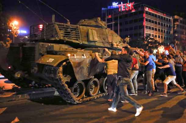 People react near a military vehicle during an attempted coup in Ankara, Turkey. REUTERS/Tumay Berkin