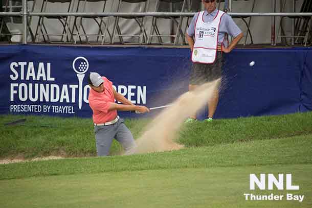 Michael Blair of Ancaster Ontario blasts out of bunker on 18th hole at Whitewater Golf Club