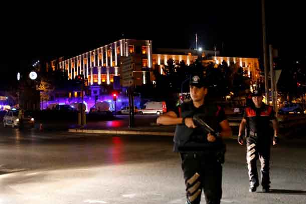 Police officers stand guard near the Turkish military headquarters in Ankara, Turkey, July 15, 2016. REUTERS/Tumay Berkin