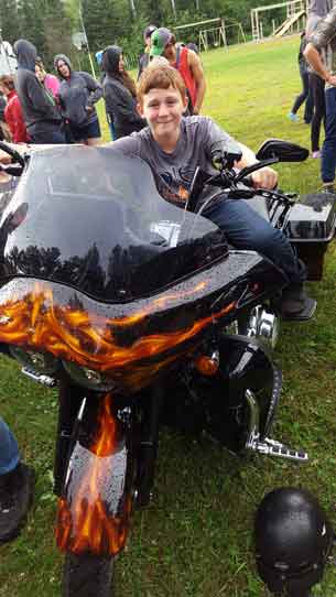 Zeke testing out the Harley Davidson motorcycle