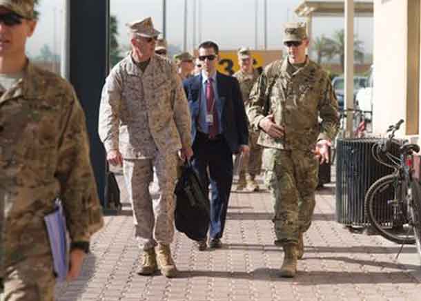 Marine Corps Gen. Joe Dunford, chairman of the Joint Chiefs of Staff, speaks to Army Lt. Gen. Sean MacFarland, commander of Combined Joint Task Force Operation Inherent Resolve, in Baghdad, July 31, 2016. Dunford is visiting Iraq to assess the campaign against the Islamic State of Iraq and the Levant. DoD Photo by Navy Petty Officer 2nd Class Dominique A. Pineiro