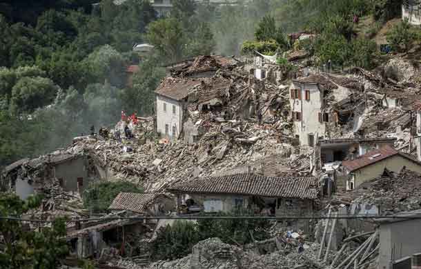 Rescuers work following an earthquake in Pescara del Tronto, central Italy. REUTERS/Adamo Di Loreto