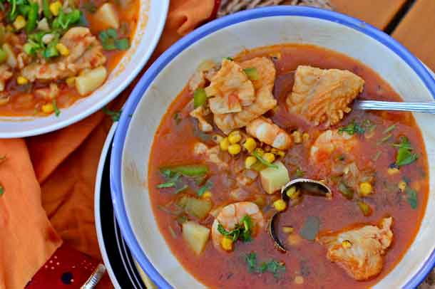 Seafood and Roasted Corn Stew. Freshly roasted corn gives this light-tasting seafood stew with tomatoes, oregano, cilantro and white wine the extra body you want in a summer main course dish. Credit: Copyright 2016 Rinku Bhattacharya