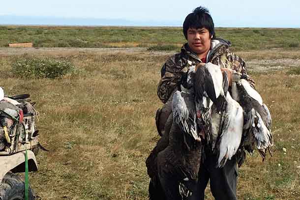 Junior Canadian Ranger Brandel Thomas with the geese he harvested