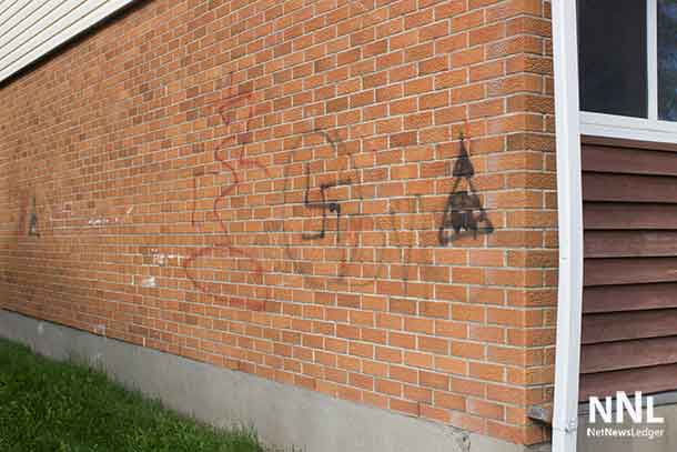 A symbol of hate painted on a wall in Academy and left for months according to tenants.