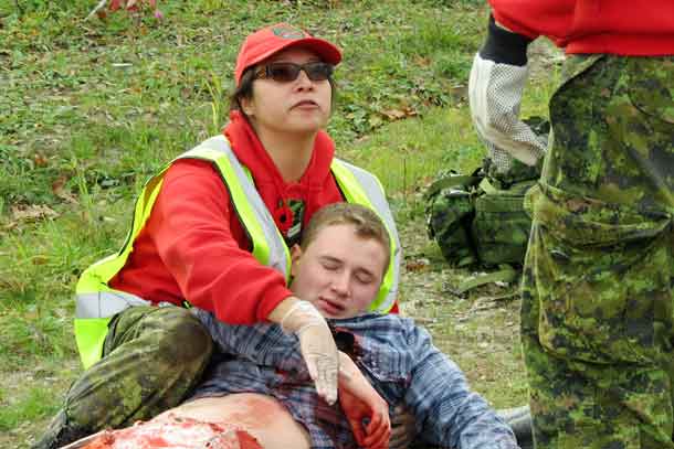 Corporal Darlene Beardy comforts an accident victim