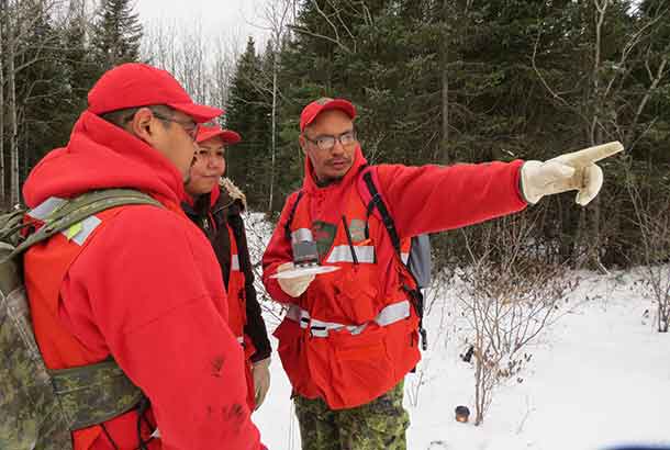 Master Corporal Charlie Barkman leads a search and rescue search party during training in Sachigo Lake.