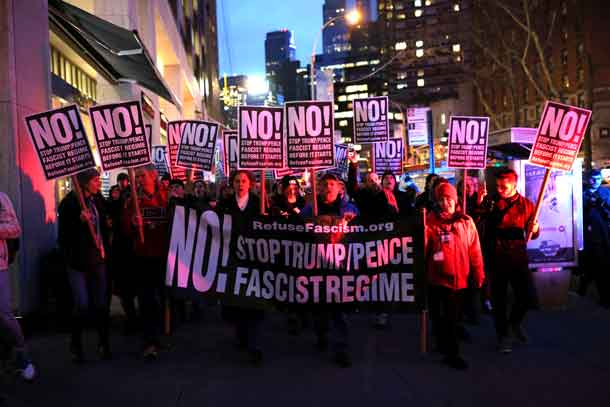 People rally against U.S. president-elect Donald Trump outside Trump International Hotel and Tower at Columbus Circle in Manhattan, New York City, U.S., January 19, 2017. REUTERS/Stephen Yang