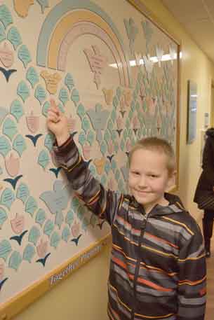 Alex Haapa-aho raised $10,665 for the Northern Cancer Fund after growing his hair for about 1.5 years. He got it shaved off on his 9th birthday on October 28, 2016, and recently returned to the Cancer Centre to place a plaque, bearing the names of his grandfathers, in memory of whom he started this project.