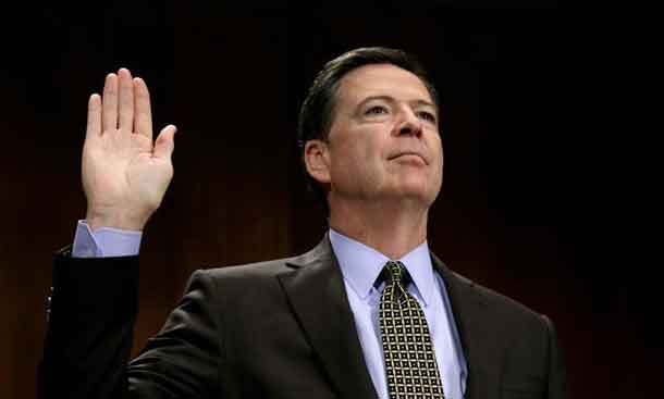 FILE PHOTO: FBI Director James Comey is sworn in to testify before a Senate Judiciary Committee hearing on "Oversight of the Federal Bureau of Investigation" on Capitol Hill in Washington, U.S., May 3, 2017. REUTERS/Kevin Lamarque