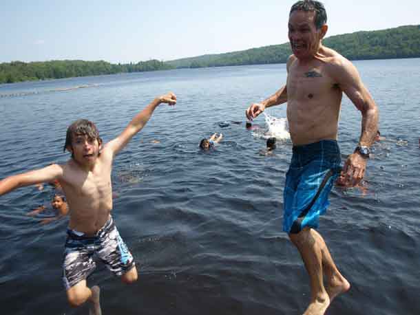 Shawn Batise,  Ontario Provincial Assistant Deputy Minister for the Negotiations and Reconciliation Division of the Ministry of Indigenous Relations and Reconciliation attended the Wabun Youth Gathering junior event recently. Here we see Batise and his son Quinton jumping into Horwood Lake. 