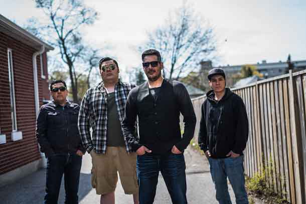 The band Midnight Shine poses for photos outside of Coalition Music in Toronto on Wednesday, May 04, 2016. The band is compromised of musicians from Northern Ontario First Nations Communities, left to right, bassist Stan Louttit from Moose Factory, lead guitar Zach Tomatuk from Moose Factory, lead singer Adrian Sutherland from Attawapiskat, and drummer George Gillies from Fort Albany. THE CANADIAN PRESS/Aaron Vincent Elkaim