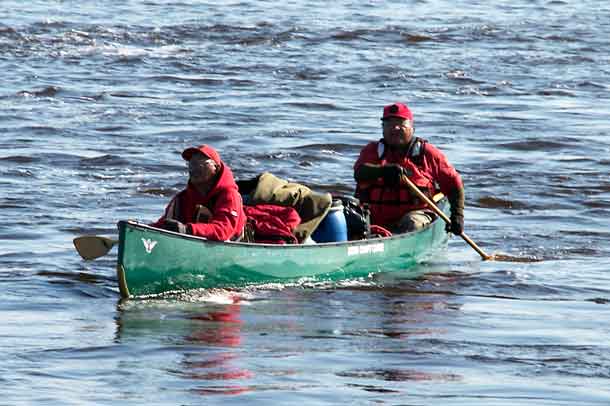 Two Canadian Rangers paddle their heavily laden canoe during the river patrol. credit: Master Corporal Kurt Rickard, Canadian Rangers