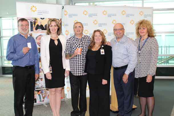 A new patient discount program will help improve patient experiences by easing the financial burden that can often accompany a hospital stay. (From left to right: Phil Thompson, Manager of Material Distribution, Dr. Rhonda Crocker Ellacott, Executive Vice President of Patient Services, Keith Taylor, Co-Chair of the Patient Family Advisor Council, Bonnie Nicholas, Patient and Family Centred Care Lead, Claudio Foresta of Kelsey's Restaurant, Montana's BBQ and Bar and 5 Forks, and Mary Nucci, Contract Procurement Specialist)